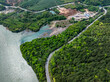 Aerial photography of the winding mountain road by the river