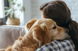 © pkroaming - Back view of young female caressing dog behind ears during leisure time at cozy apartment. Young woman and golden retriever enjoying bonding interaction together during daytime