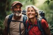 © venusvi - A close-up photo of a senior couple hiking through a lush forest, their faces filled with a sense of adventure.