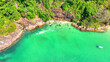 A mesmerizing drone's eye view of a stunning tropical seascape, where crystal-clear waters meet lush green shores. Tourism and nature concept. Mu Ko Chang National Park, Thailand.
