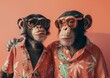 Two monkeys seem to be ready for a summer party, dressed in shirts that suggest they're on vacation, bringing a fun twist to a holiday trip