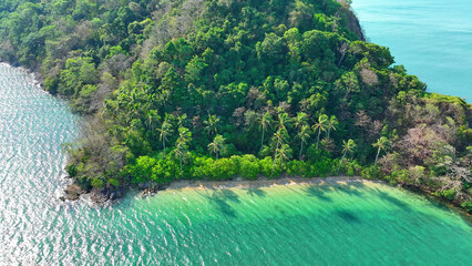 Experience tropical bliss from a bird's-eye view. Crystal-clear sea, sandy shore, and lush coconut palms. Nature's masterpiece. Tourist attractions concept. Mu Ko Chang National Park, Thailand. 
