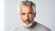 © ALA - Handsome elderly elegant Latino with gray hair, on a white background, banner, active old age.