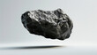 © AstraNova - Raw Rare stone floating black rock meteorite material isolated on white background
