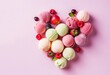 Assorted  various colorful fruits ice laid out in the shape of a heart on light pink background.  Fruits ice cream balls and berries, Summer cool desserts concept. World ice cream day, Place for text