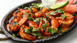 Fototapeta  - Indian seafood dish tandoori shrimp with herbs and spices grilled on black iron plate isolated on white background created with Generative AI Technology