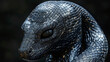 A snake with a black head and a black body. The snake is curled up and has a menacing look on its face