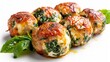 Gourmet shot of chicken meatballs filled with mozzarella and spinach, perfectly baked, spotlighted in studio, white backdrop