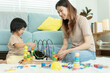 © Shisu_ka - Happy Asia mother play and learn toy blocks with the little girl. Funny family is happy and excited in the house. Mother and daughter having fun spending time together. Holiday, Activity, development