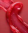 Background of red lip gloss, waves with water drops. Smudged makeup product sample. 