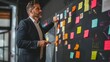 © KerXing - A businessman presenting a project plan to his team