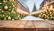 a high-resolution image of an empty wooden table set against a beautifully blurred Christmas background, with twinkling lights and festive decorations subtly visible