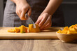 Organic pumpkin cutting on wooden board, Homemade cooking, Food ingredient