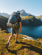 Man hiking solo with backpack in Norway mountains travel outdoor active summer vacations healthy lifestyle extreme sports, traveler exploring Lofoten islands