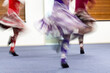 Young girls enjoying Highland dancing at a dance club. Motion blur of beautiful flying skirts captured in camera by using slow shutter speed.
