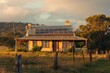 Wooden house with solar panels during golden hour in rural setting. AI-generated