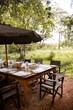 table set up for lunch outside at camp on safari in the Masai Mara in Kenya