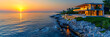 Serene Sea at Sunset, Rocky Coastline View, Tranquil Summer Evening, Travel and Nature