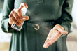 © peopleimages.com - Business person and hands with spray bottle or sanitiser to clean virus and bacteria for safe workplace. Health, compliance and woman in closeup with disinfectant for hygiene and germ protection