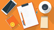 Work planning top view of a desk with a notepad 
