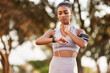 © peopleimages.com - Woman, time and headphones with pulse in outdoor for training, sports or fitness for wellness. Female runner, feeling and heart rate with cardio in nature for health, goals with smart watch app