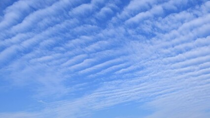 Wall Mural - Blue sky with fluffy cloud time lapse on a sunny day 4k footage.