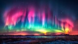 Fototapeta Tęcza - Aurora: A breathtaking photo capturing the vibrant colors of the aurora borealis dancing across the night sky