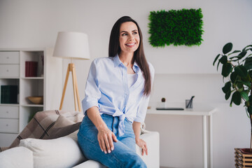 Poster - Portrait of pretty lady sit sofa contemplate think wear shirt bright interior apartment indoors