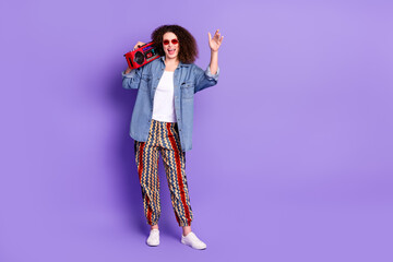 Wall Mural - Full body photo of cool nice girl dancing boombox empty space wear denim shirt isolated on violet color background