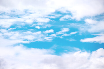 Wall Mural - Clouds frame with small patterns on bright blue sky background