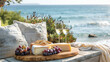 White wine in glasses, appetizers and grapes on a wooden table overlooking the seashore