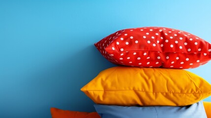 Wall Mural - Stack of pillows against blue wall