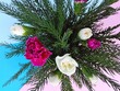 Bouguet of carnation flowers and fir tree branches. Violet flowers in vase on paper colorful blue background. Carnations pattern for Victory Day in 9 may, womans or mothers day pink greeting card.