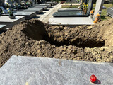 Fototapeta Do pokoju - Newly dug out grave site in the public cemtery