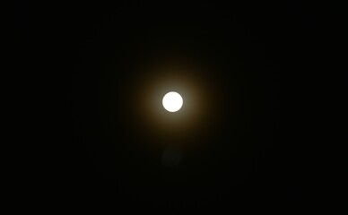 Wall Mural - bright yellow full moon floating on sky in night background