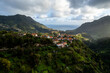 Madeira Island landscape, small village on hills and green lush forest. Aerial drone view. Portugal travel.
