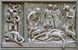 MILAN, ITALY - SEPTEMBER 16, 2024: The relief of Martyrdom of St. Victor on the bronze gate of Cathedral - Duomo by Arrigo Minerbi (1937 - 1948)