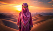 A beautiful arabiawoman in a pink hijab stands in the desert with the sunset behind her head.Ai generated
