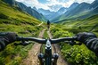 A first-person perspective captures the thrilling experience of mountain biking along a narrow trail in a picturesque mountainous region.