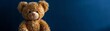 A charming teddy bear, dressed in a laid-back fashion, showcasing a broad grin in a playful animated manner, exuding a relaxed, trendy vibe against a deep blue backdrop with room for text.