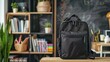 Casual yet fashionable black school bag ready for a new academic year, displayed in a lively school setting with books and stationery around
