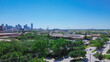 Tree canopy cover green Wycliff Ave in Stemmons Corridor or Lower Stemmons neighborhood, downtown Dallas skylines, Margaret Hunt Hill Bridge in background, industrial, commercial property, aerial