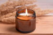 Scented burning candle with pampas grass