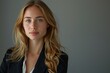 © Kristian - Confident Businesswoman in Studio in gray background