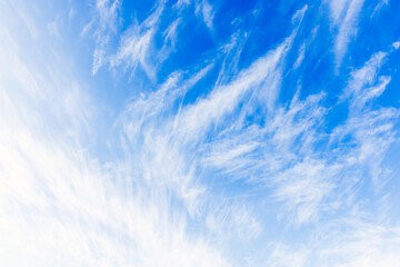 Wall Mural - white cirrus clouds are in blue sky, natural background photo texture