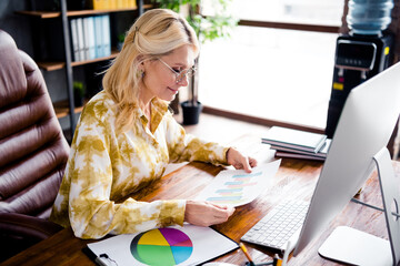 Sticker - Portrait of successful adorable senior business lady sitting chair reading documents report statistics indoors workstation workspace