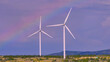 AERIAL: Wind farm stands tall against sky showcasing renewable energy technology