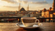 Traditional Turkish coffee in porcelain mug on table in front of blurry Istanbul view with buildings, bridge a mosque during sunset.