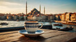 Traditional Turkish coffee in porcelain mug on table in front of blurry Istanbul view with buildings, ferry boats, and a mosque during sunset