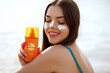 Woman smile applying sun cream on face. Skincare. Body Sun protection. sunscreen. Female smear moisturizing lotion on skin.